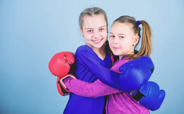 punching knockout. Childhood activity. workout of small girls boxer in sportswear. Sport success. Friendship. Fitness diet. energy health. Happy children sportsman in boxing gloves. we are the best