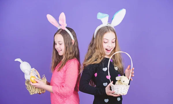 Sisters celebrate easter. Spring holiday. Happy childhood. Easter day. Easter activities for children. Happy easter. Holiday bunny girls with long bunny ears. Egg and bunny holiday attribute
