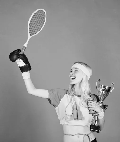 Woman good in tennis jumping boxing fitness sport. She is best in all competitions. Sport champion. Fitness champion. Champion concept. Girl sport instructor hold golden goblet of winner or champion — Stock Photo, Image