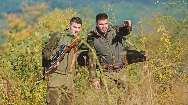 Military uniform fashion. Hunting skills and weapon equipment. How turn hunting into hobby. Friendship of men hunters. Man hunters with rifle gun. Boot camp. Army forces. Camouflage. follow this way