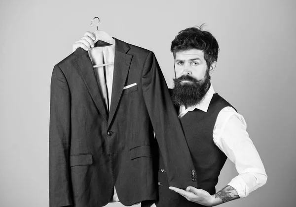 Elegant custom outfit. Tailoring and clothes design. Perfect fit. Custom made to measure. Tailored suit concept. Designing made to measure suit. Custom made suit. Man bearded fashion couturier tailor