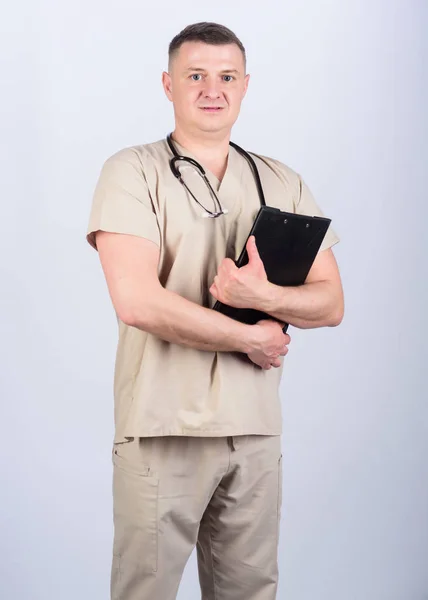 Man in medical uniform. Treatment prescription. nurse laboratory assistant. family doctor. medicine and health. confident doctor with stethoscope. pediatrician intern. Medical tool. medical folder — Stock Photo, Image