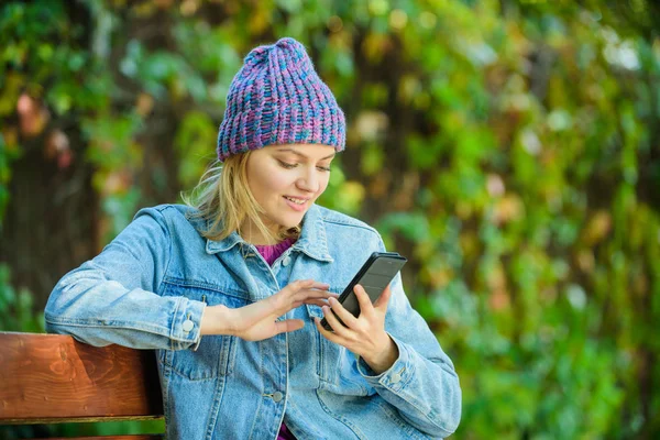 Stay touch with modern smartphone. Mobile call concept. Girl with smartphone green nature background. Woman having mobile conversation. Mobile communication and social networks. Girl call friend