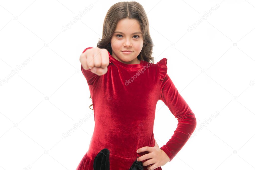 Just a girl boss building her empire. little girl child hold fist isolated on white. childrens day. childhood happiness. beauty and fashion. small pretty girl with happy face. knockout power