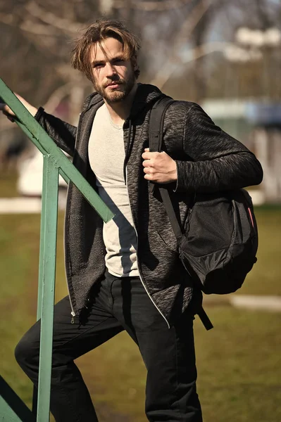 Active concept. Active man with backpack outdoor. Active and healthy lifestyle. As active as you dare to be