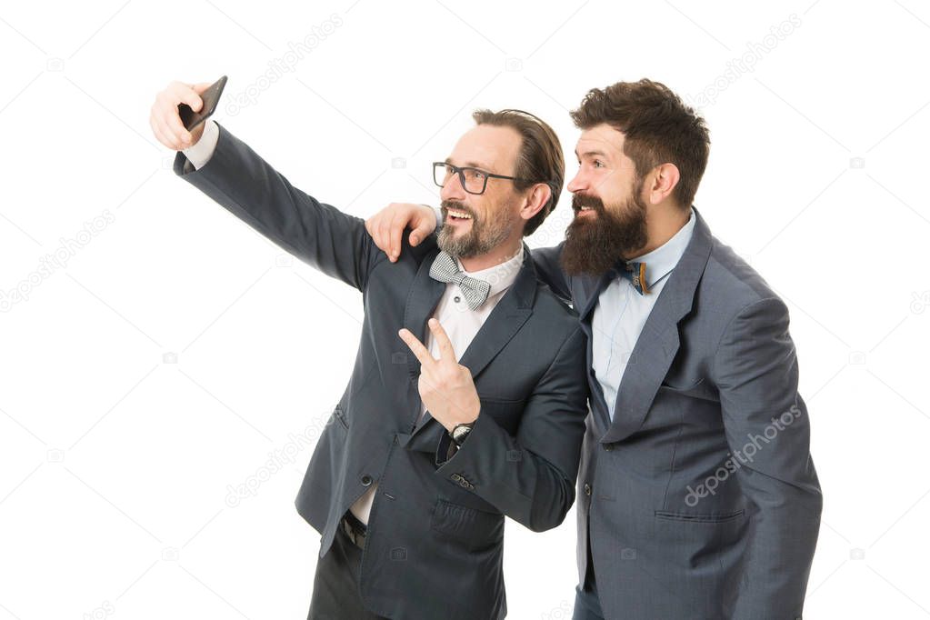 Taking photo with business idol. Selfie of successful friends. Entrepreneurs taking selfie together. Business people concept. Men bearded guys formal suits. Business conference famous speaker