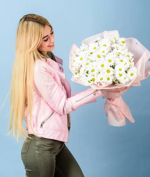 Adore flowers. Girl tender sensual blonde hold flowers bouquet. Flowers delivery service. Chamomile flower symbol of innocence and tenderness. Celebrating her special day. Surprise for girlfriend