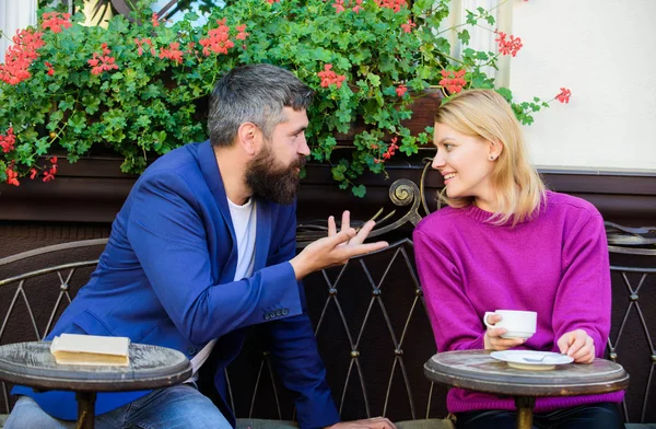 Couple terrace drinking coffee. Casual meet acquaintance public place. Romantic couple. Normal way to meet and connect with other single people. Meet become acquaintances. Meeting people first date