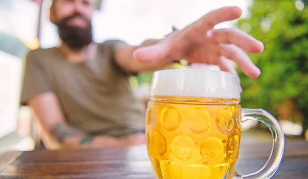 Distinct beer culture. Mug cold fresh beer on table close up. Man sit cafe terrace enjoying beer defocused. Alcohol and bar concept. Creative young brewer. Craft beer is young, urban and fashionable — Stock Photo, Image