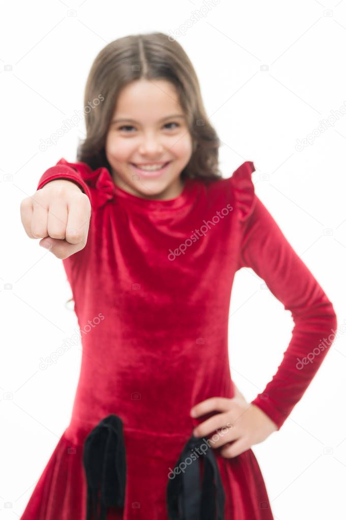 Modern feminism. small pretty girl with happy face hold fist. skincare and kid hairdresser. childrens day. childhood happiness. beauty and fashion. little girl child isolated on white. punching