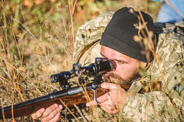 Hunting skills and weapon equipment. How turn hunting into hobby. Bearded man hunter. Army forces. Camouflage. Military uniform fashion. Man hunter with rifle gun. Boot camp. Army soldiers