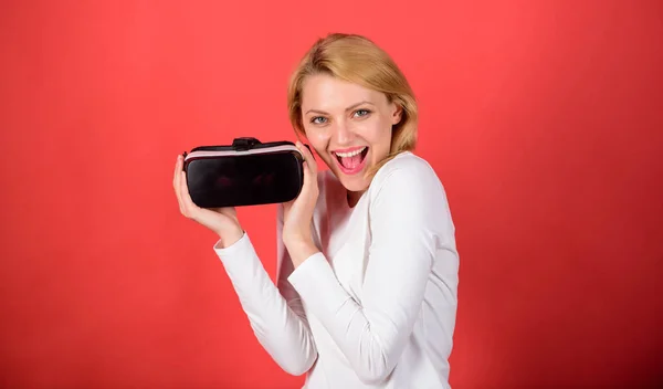 Young woman using a virtual reality headset with conceptual network lines. Woman using virtual reality headset. A person in virtual glasses flies in room space. Office innovation.