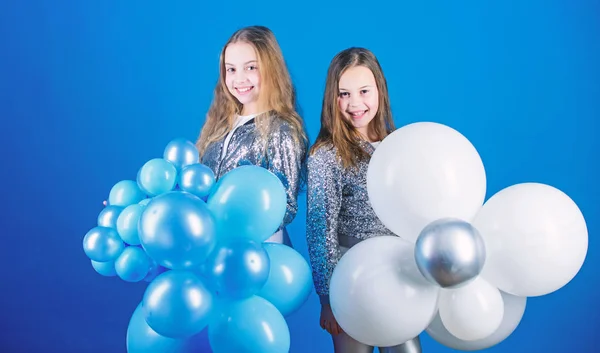 Balloon theme party. Girls little siblings near air balloons. Birthday party. Happiness and cheerful moments. Carefree childhood. Start this party. Sisters organize home party. Having fun concept