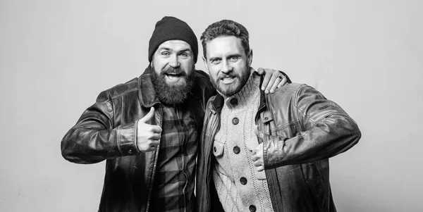 Real men and brotherhood. Friends glad see each other. Friendly relations. Friendship of brutal guys. Real friendship mature friends. Male friendship concept. Brutal bearded men wear leather jackets — Stock Photo, Image