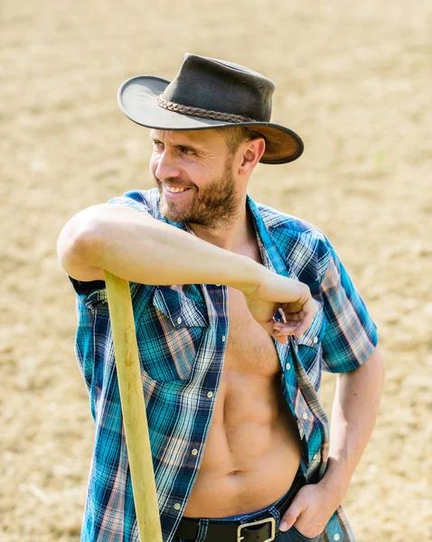 Happy earth day. Eco living. Eco farm. Harvest. muscular ranch man in cowboy hat. farming and agriculture cultivation. Garden equipment. sexy farmer hold shovel. Made with love — Stock Photo, Image