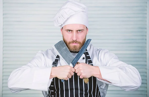 Dangerous kitchen. chef ready for cooking. confident man in apron and hat hold knife. bearded man loves food. Professional in kitchen. culinary cuisine. cook in restaurant. I need you at the kitchen — Stock Photo, Image