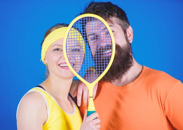 We are one. Athletic Success. Sport equipment. Happy woman and bearded man workout in gym. Strong body muscles. Sporty couple train with tennis racket. We know how to score. happy to train together