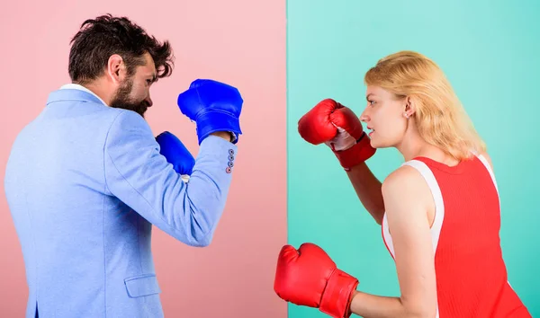 Man formal suit and athletic woman boxing fight. Couple in love competing in boxing. Female and male boxers fighting in gloves. Domination concept. Gender battle. Gender equal rights. Gender equality — Stock Photo, Image