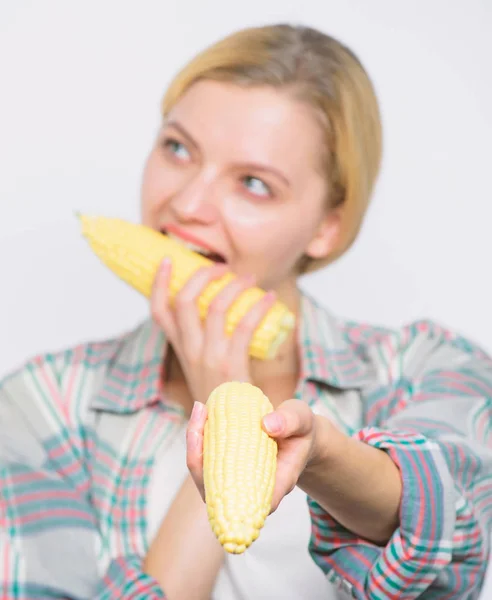 Rish harvest. healthy teeth. corn crop. vitamin dieting food. Farming, farmer girl with maize. agriculture and cultivation. Happy woman eating corn. vegetable harvest. harvest festival. harvestin — Stock Photo, Image