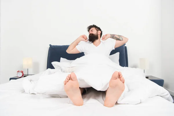 Total relaxation. energy and tiredness. Sleepy and handsome. mature male with beard in pajama on bed. bearded man wake up in morning. asleep and awake. Too early to wake up. sleepy man in bedroom