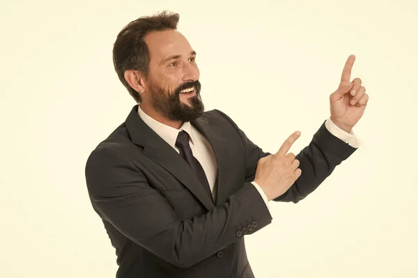 Pointing direction. Man pointing index fingers isolated on white. Man bearded mature in formal wear. Businessman or manager with beard and mustache shows direction. Look at that advertisement
