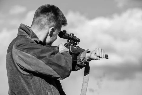 Hunting optics equipment for professionals. Brutal masculine hobby. Man aiming target nature background. Aiming skills. Hunter hold rifle aiming. On my target. Bearded hunter spend leisure hunting — Stock Photo, Image