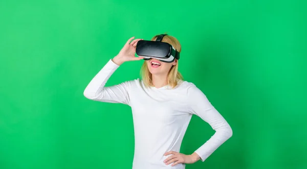 Young woman using a virtual reality headset with conceptual network lines. Woman with virtual reality headset. Cheerful smiling woman looking in VR glasses. Futuristic.
