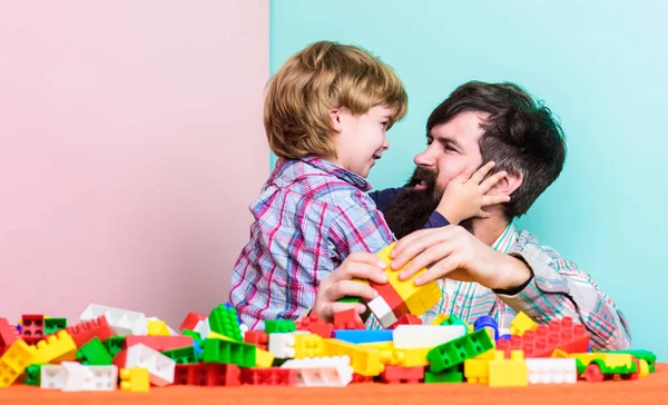 Back to our roots. child development. building home with colorful constructor. happy family leisure. father and son play game. small boy with dad playing together. copy space. embraces are best — Stock Photo, Image