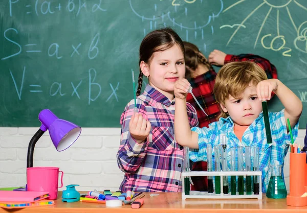 students doing science experiments with microscope in lab. back to school. school kids scientist studying science. children. Little kids learning chemistry in school laboratory. Concentrated on exam