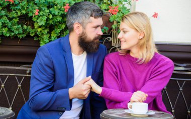 Casual meet acquaintance public place. Romantic couple. Normal way to meet and connect with other single people. Meet become acquaintances. Meeting people first date. Couple terrace drinking coffee clipart