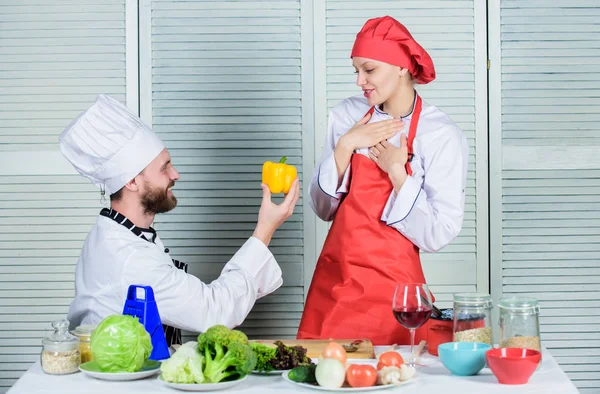 marry me. Dieting and vitamin. culinary cuisine. Family cooking in kitchen. man and woman chef in restaurant. happy couple in love with healthy food. vegetarian. cook uniform. proposal concept