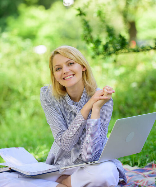 Online freelance career concept. Pleasant occupation. Guide starting freelance career. Business lady freelance work outdoors. Become successful freelancer. Woman with laptop sit on rug grass meadow