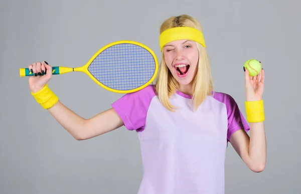 Active leisure and hobby. Athlete hold tennis racket in hand on grey background. Tennis sport and entertainment. Tennis club concept. Girl adorable blonde play tennis. Sport for maintaining health — Stock Photo, Image