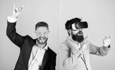 Real fun and virtual alternative. Man with beard in VR glasses and louvered plastic accessory. Guy interact in virtual reality. Hipster exploring virtual reality. Business implement modern technology clipart