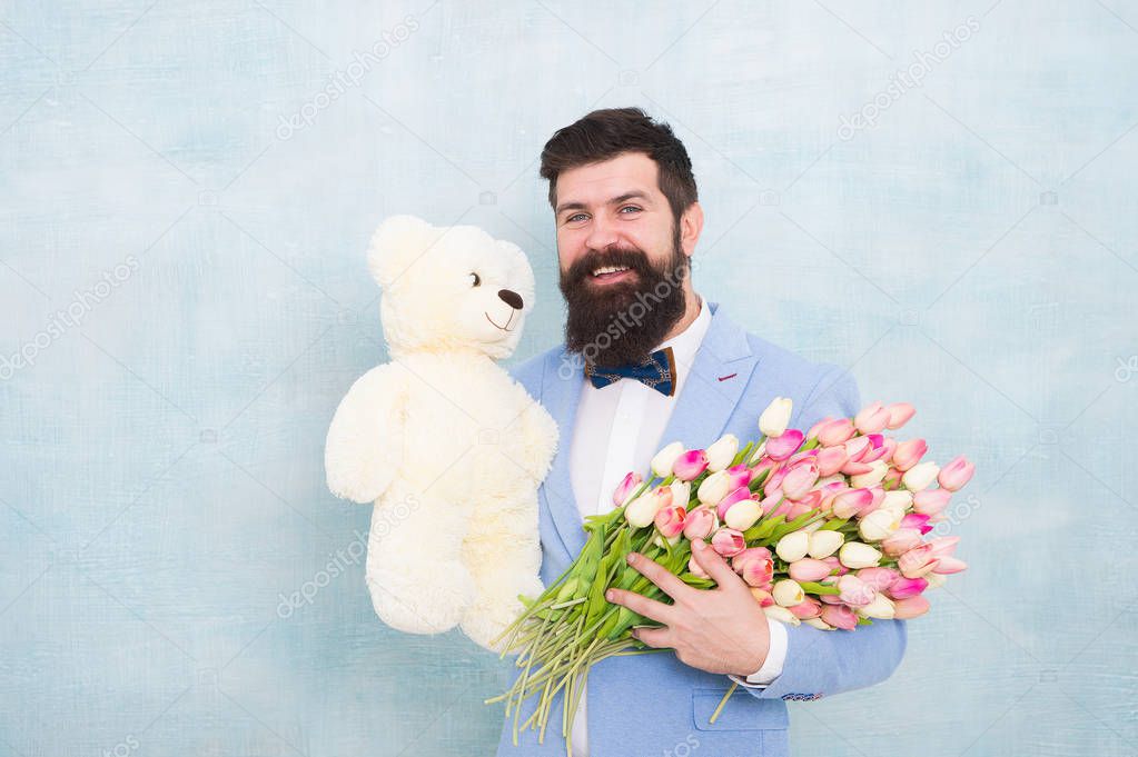 spring bouquet. 8 of march. bearded man in bow tie with tulip flowers. love date with flowers. Happy Birthday. bride groom at wedding party. womens day. Formal mature businessman. i love you