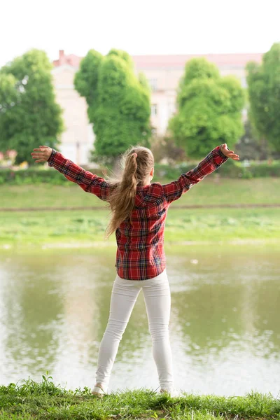 Place of power. Peaceful place. River clears the mind. Find peace and relax in nature. Calm and peaceful. Life balance. Peaceful mood. Girl little cute child enjoy peace and tranquility at riverside