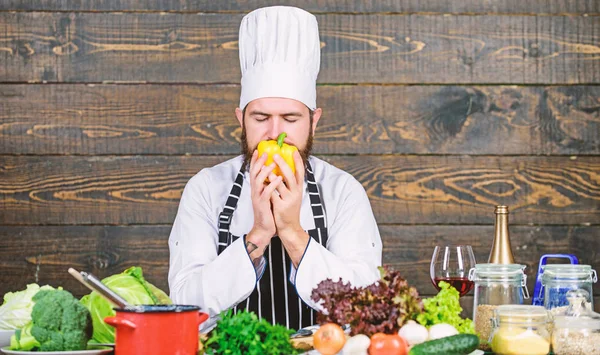 Chef use fresh organic vegetables for dish. Vegetarian meal. Freshest possible ingredients. Organic food. Fresh ingredients only. Man bearded hipster cooking fresh vegetables. Culinary recipe concept