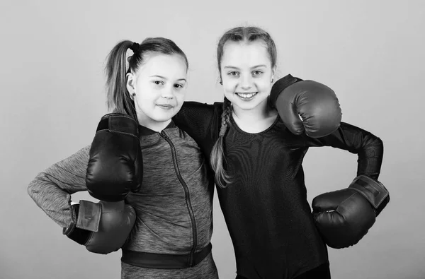 Everything is possible. Happy children sportsman in boxing gloves. workout of small girls boxer in sportswear. punching knockout. Childhood activity. Fitness diet. energy . Sport success. Friendship — Stock Photo, Image