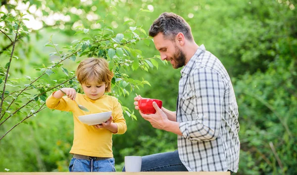 Family enjoy homemade meal. Healthy breakfast. Father son eat food. Little boy and dad eat. Nutrition kids and adults. Tasty porridge. Organic nutrition. Healthy nutrition concept. Nutrition habits — Stock Photo, Image