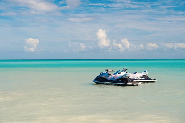 Lets ride. Sea turquoise water pair watercrafts near beach. Extreme entertainment tropical vacation. Best vacation spots for extreme summer sports. Spend vacation exciting occupation st.johns antigua — Stock Photo, Image