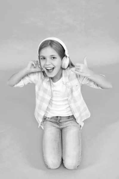 Little girl listen song headphones. Enjoy track of favorite band. Girl child listen music modern headphones. Get music account subscription. Enjoy music concept. Music always with me. Leisure concept — Stock Photo, Image
