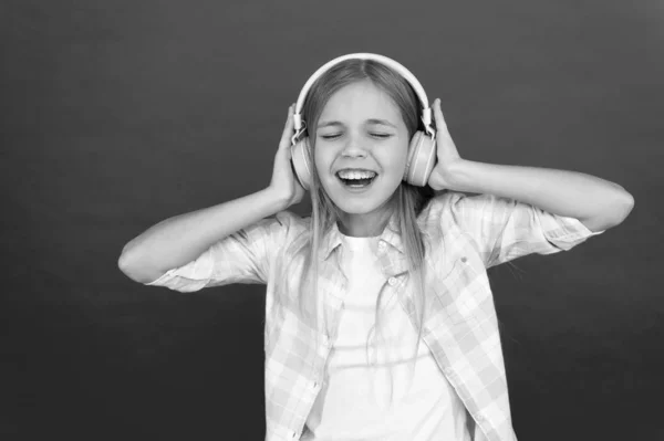 Music always with me. Little girl listen song headphones. Online radio station channel. Leisure concept. Girl child listen music modern headphones. Get music account subscription. Enjoy music concept — Stock Photo, Image