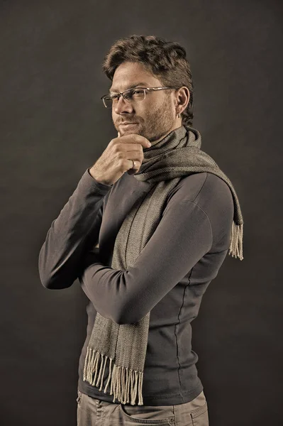 Man in scarf and sweater