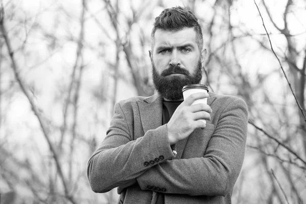 Drink it on the go. Man bearded hipster prefer coffee take away. Businessman drink coffee outdoors. Reloading energy. Relaxing coffee break. Hipster hold paper coffee cup and enjoy nature environment — Stock Photo, Image
