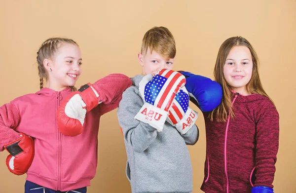 energy health. punching knockout. Childhood activity. Sport success. Team fight. workout of small girls and boy boxer. Happy children in boxing gloves. Fitness diet. Having a little break