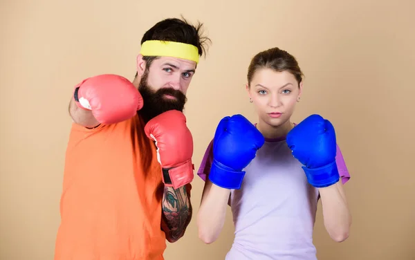 Training with coach. sportswear. Fight. knockout and energy. couple training in boxing gloves. punching, sport Success. Happy woman and bearded man workout in gym. Hustle, hit and never quit — Stock Photo, Image