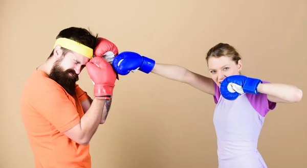 Family battle. Man and woman in boxing gloves. Boxing sport concept. Couple girl and hipster practicing boxing. Sport for everyone. Amateur boxing club. Equal possibilities. Strength and power