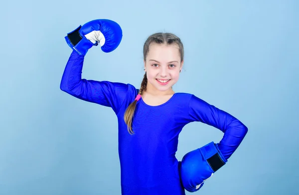 Training to be the best. punching knockout. Childhood activity. Fitness diet. energy health. workout of small girl boxer. Sport success. sportswear fashion. Happy child sportsman in boxing gloves