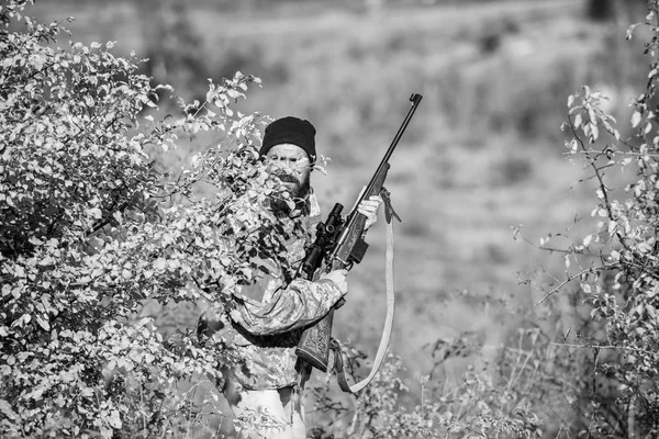 Bearded man hunter. Military uniform fashion. Army forces. Camouflage. Hunting skills and weapon equipment. How turn hunting into hobby. Man hunter with rifle gun. Shoot straight and look great — Stock Photo, Image