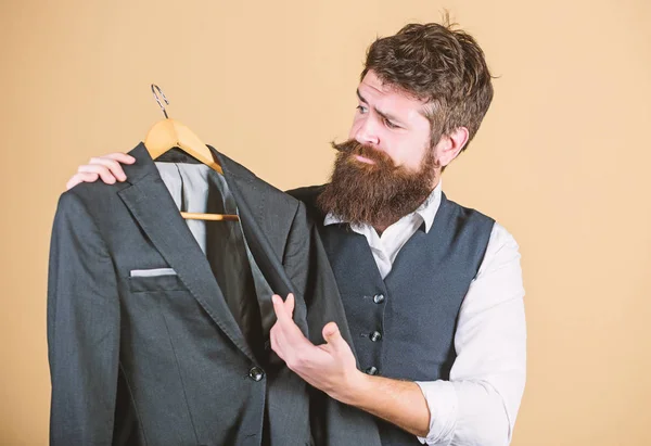 Elegant custom suit. Tailoring and clothes design. Perfect fit. Custom made to measure. Tailored suit concept. Fashion for business people. Custom made suit. Man bearded fashion couturier tailor